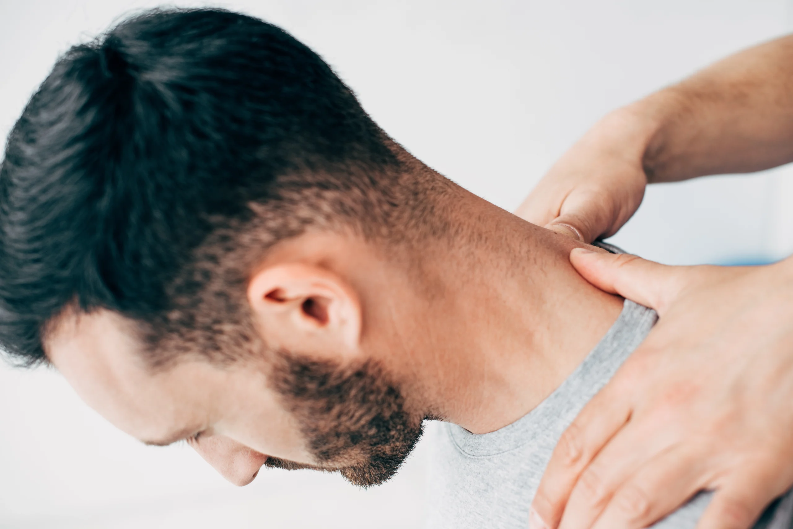 man-receiving-neck-treatment